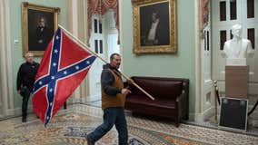 FBI: Delaware man seen holding confederate flag during Capitol riot surrenders