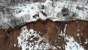 Grafton rescue 2 women, dog from muddy bluff in Lions Den Park