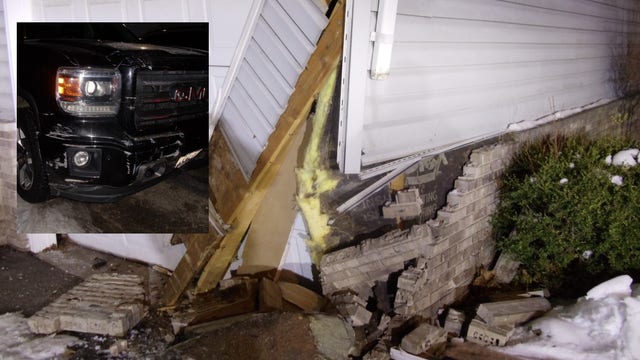 Man taken into custody for OWI after crashing into apartment building