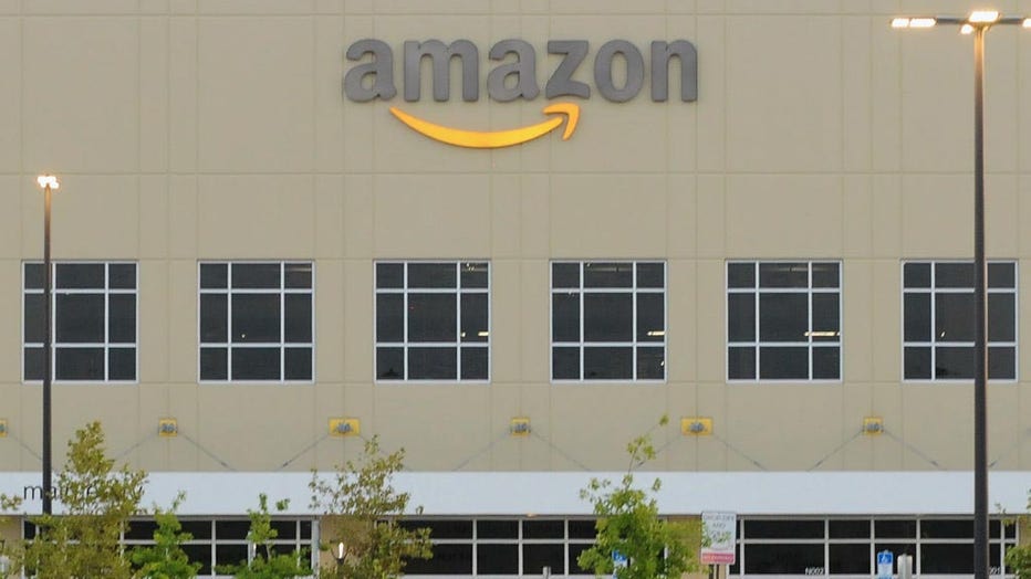 Employee vehicles are seen in the parking lot at an Amazon fulfillment center on July 14, 2019 in Orlando, Florida. (Photo by Paul Hennessy/NurPhoto via Getty Images)