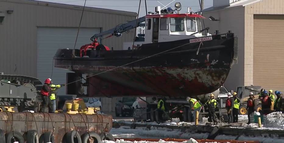 Crews retrieve Port workboat Harbor Seagull from river bottom