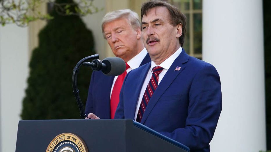 FILE - Then-President Donald Trump listens as Mike Lindell, CEO of MyPillow Inc., speaks during the daily briefing on COVID-19 in the Rose Garden of the White House in Washington, DC, on March 30, 2020. (Photo by MANDEL NGAN/AFP via Getty Images)