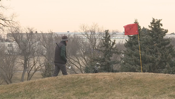 Par for the course: March snowstorm nears, golfers squeeze in a round