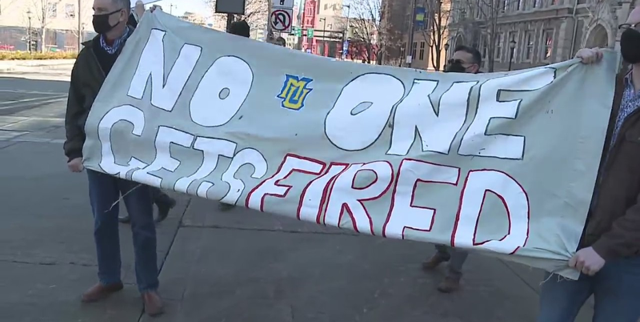 Group protests Marquette layoffs, calls for worker reinstatement