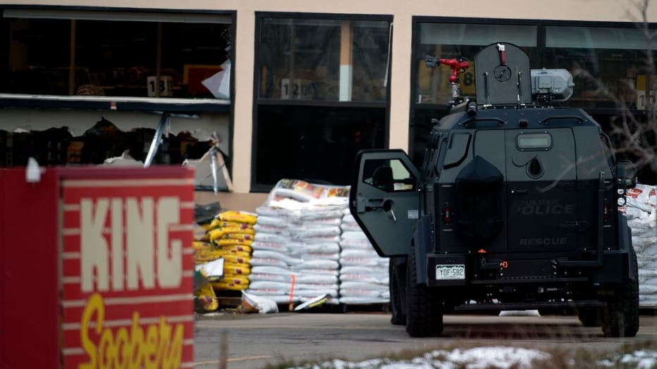 An armored vehicle is parked outside the entrance of the King Soopers grocery store in Boulder, Colorado where a mass shooting took place on March 22, 2021. (Photo by JASON CONNOLLY/AFP via Getty Images)