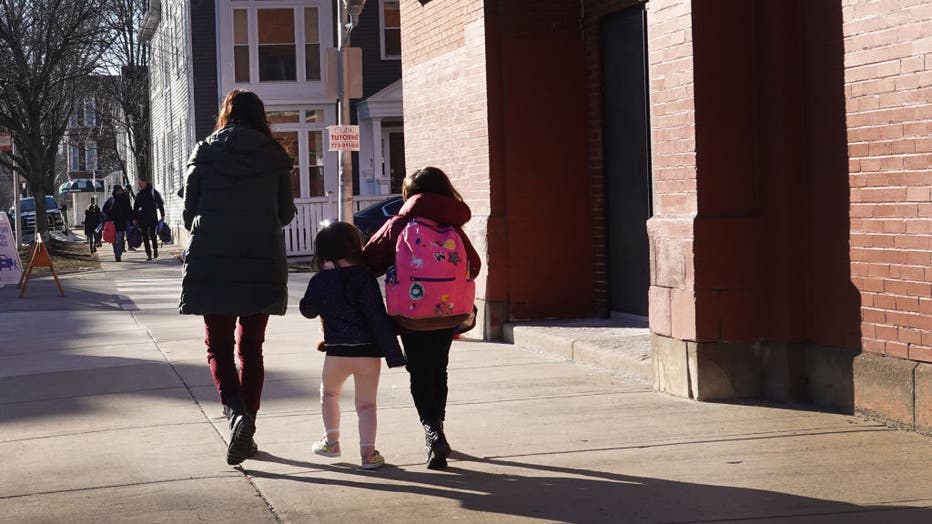 FILE - Parents pick up their children from school on March 1, 2021 in Chicago, Illinois. (Photo by Scott Olson/Getty Images)