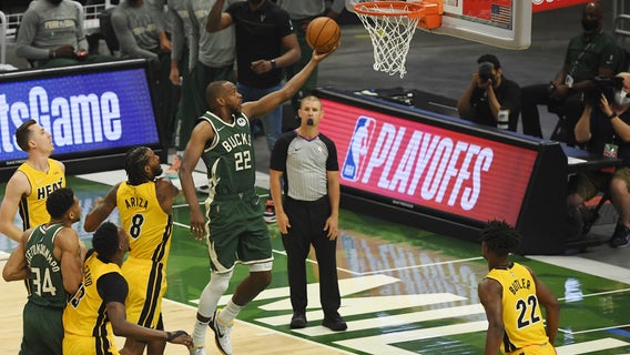 Khris Middleton lifts Bucks past Heat in OT in Game 1