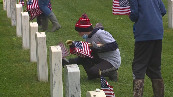 Memorial Day: Students place flags at Wood National Cemetery