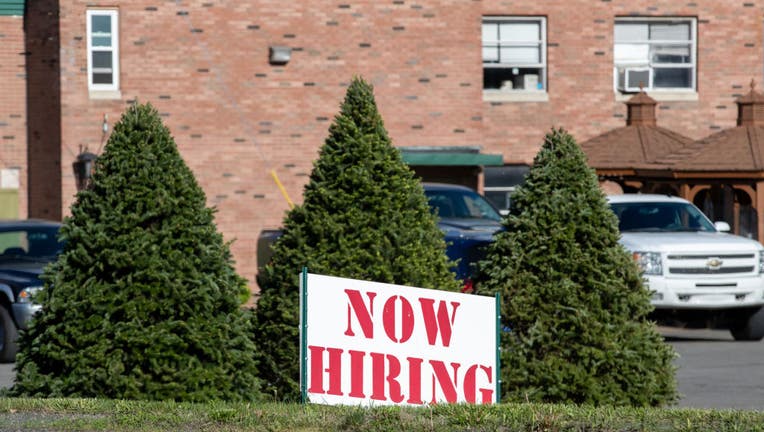 FILE - A now hiring sign is seen outside the International Paper's corrugated box manufacturing plant on May 13, 2021, in Mount Caramel, Pennsylvania. (Photo by Paul Weaver/SOPA Images/LightRocket via Getty Images)