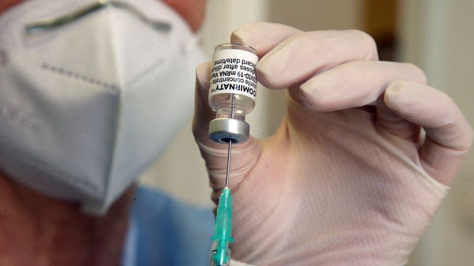 FILE - A doctor draws up a syringe with a COVID-19 vaccine in Berlin, Germany on May 5, 2021. (Photo by Wolfgang Kumm/picture alliance via Getty Images)