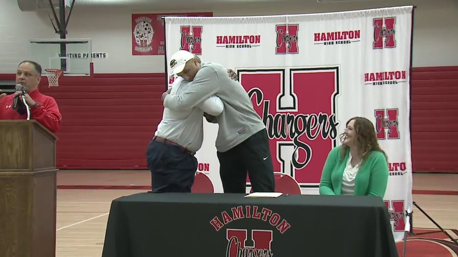 Patrick Baldwin Jr. embraces his father and new head coach