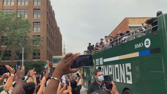 Before championship parade, Bucks fans try to get sneak peek at team