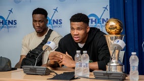 Giannis in Greece with Bucks' championship trophies