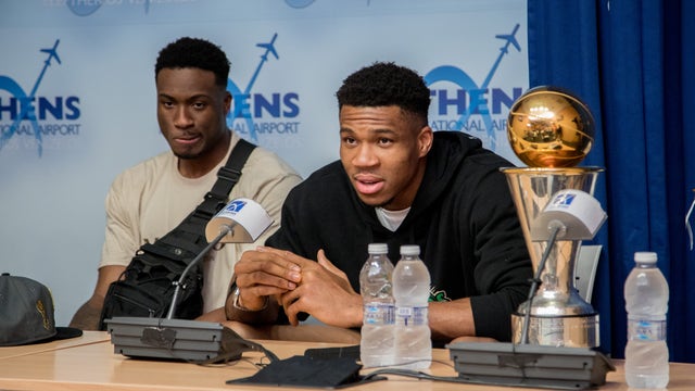 Giannis in Greece with Bucks' championship trophies