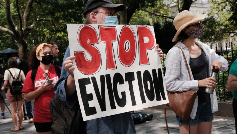 FILE - Activists hold a protest against evictions near City Hall on Aug. 11, 2021, in New York City. (Photo by Spencer Platt/Getty Images)