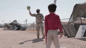 US soldiers play with evacuee Afghan children in Texas