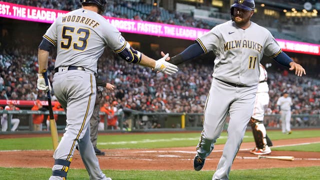 Cain homers, Woodruff pitches Brewers past Giants 6-2