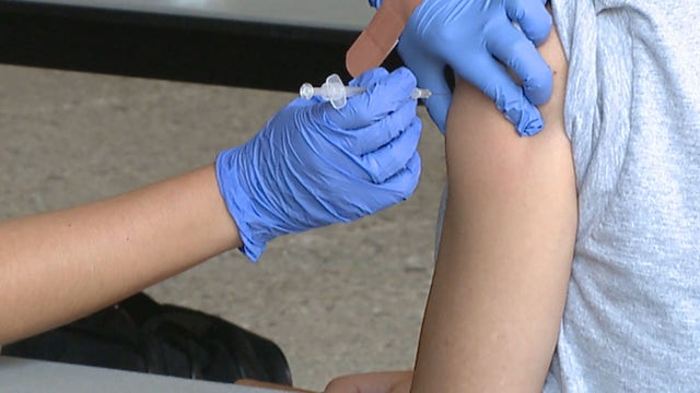 Omicron variant in Milwaukee County man, vaccines pushed