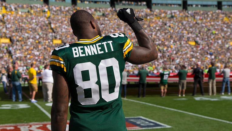 Green Bay Packers tight end Martellus Bennett #80 holds his fist in the air during the national anthem prior to the game against the Seattle Seahawks at Lambeau Field on Sept. 10, 2017. (Jeff Hanisch-USA TODAY Sports)