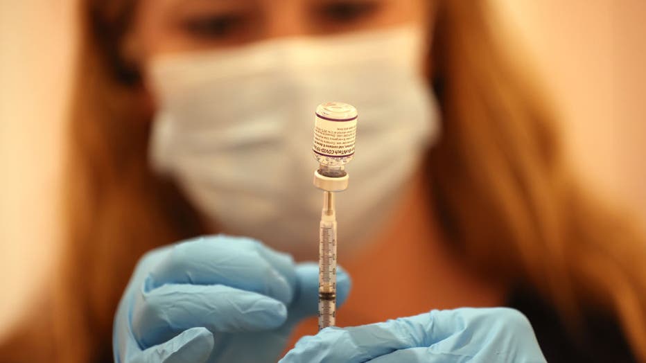 871a60aa-Vaccination Clinic Administers Booster Shots In California