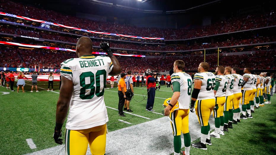 Martellus Bennett #80 of the Green Bay Packers raises his fist during the national anthem prior to the game between the Green Bay Packers and the Atlanta Falcons at Mercedes-Benz Stadium on Sept. 17, 2017 in Atlanta, Georgia. (Photo by Kevin C. Cox/Getty Images) (Kevin C. Cox/Getty Images)