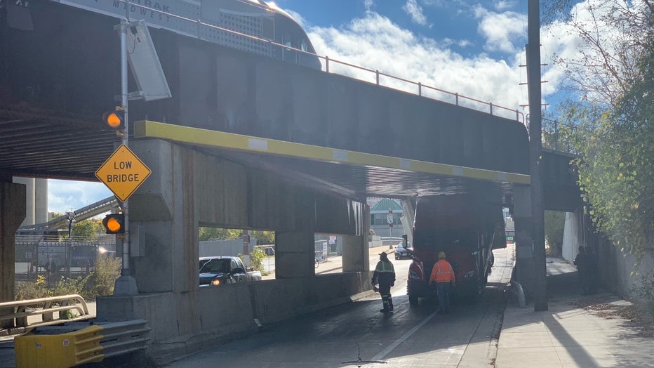 Truck stuck at bridge on S. Kinnickinnic Avenue at the KK River