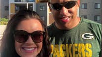 Packers fans cheer from Australia, team united couple