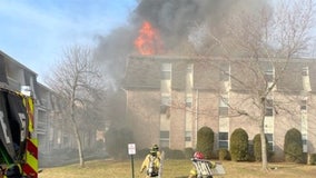 NJ cops and firefighters catch baby dropped from 2nd floor of burning building