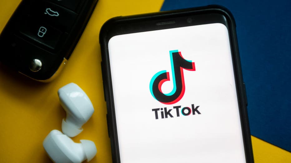 6277f480-In this photo illustration a TikTok logo seen displayed on a