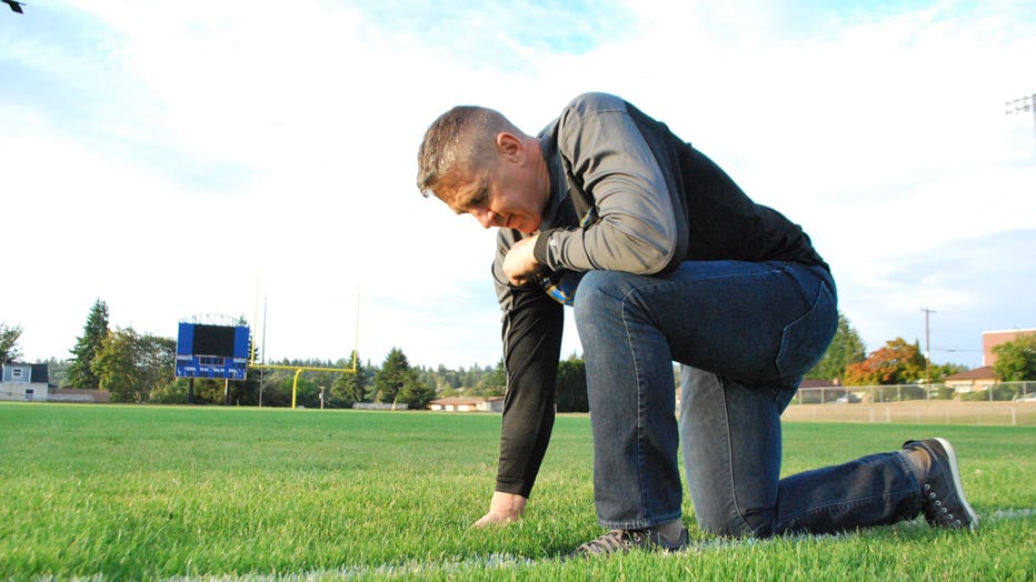 Coach-Kennedy-Bremerton-High-Footbal-Field-Kneeling-Wide-Shot