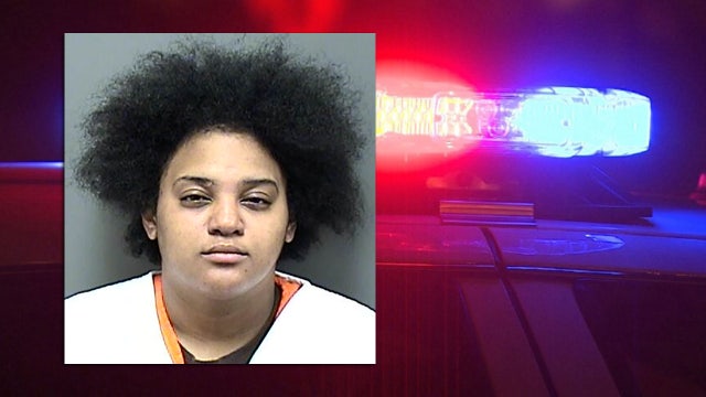 Racine woman accused; striking another woman, infant