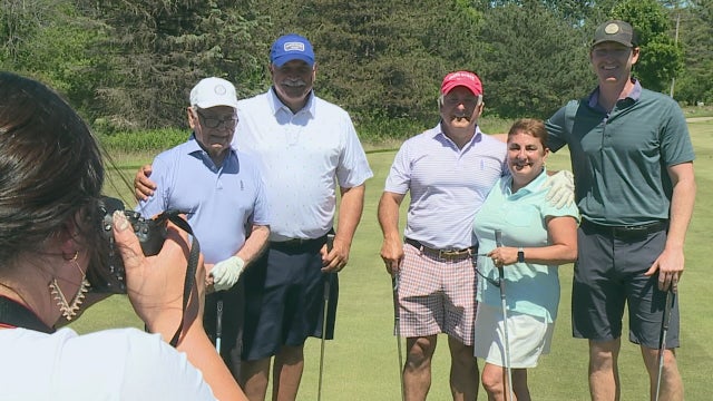 Alzheimer's patient fulfills dream by playing golf with family