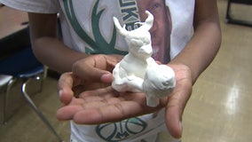 Young students make bobbleheads; purpose behind this art project