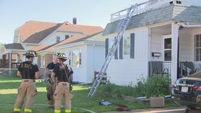 Racine house fire; man rescued from balcony, treated for injuries