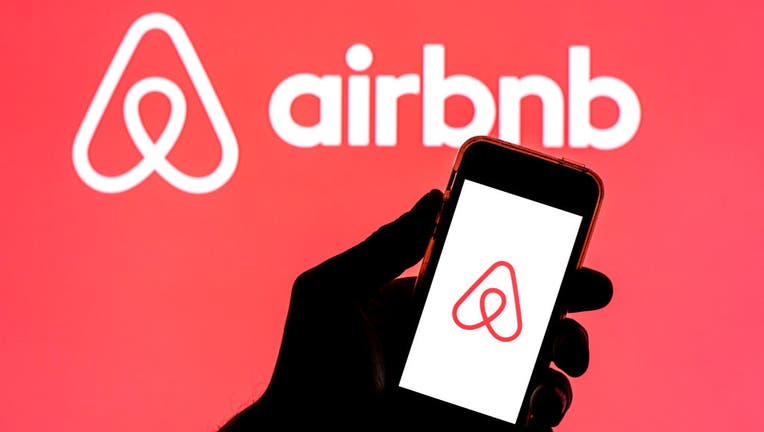 d90b6cf4-In this photo illustration, the Airbnb app seen displayed on