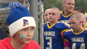 New Berlin football players shave heads, dedicate game to classmate