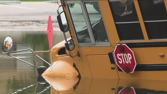Elm Grove flooding; school bus stranded in water
