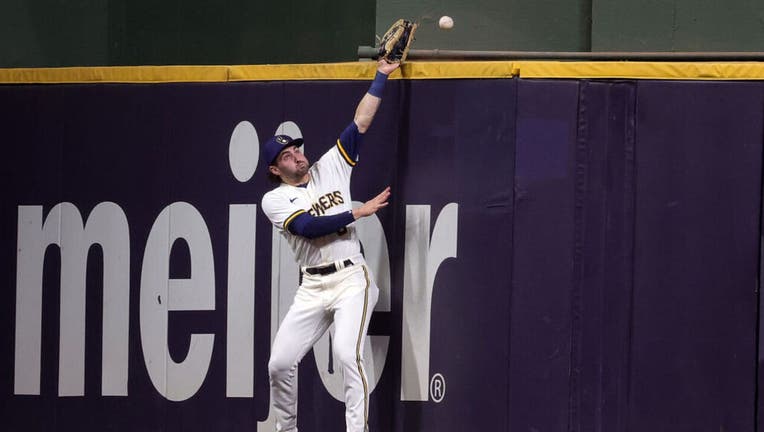 Cardinals pitcher Miles Mikolas swings a big bat in Brewers' home