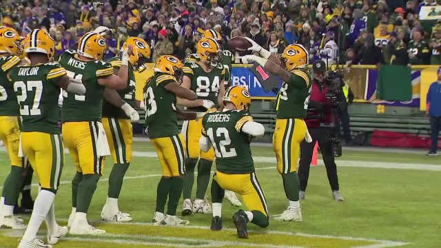 Packers celebration, Whitewater band director's gift for AJ Dillon