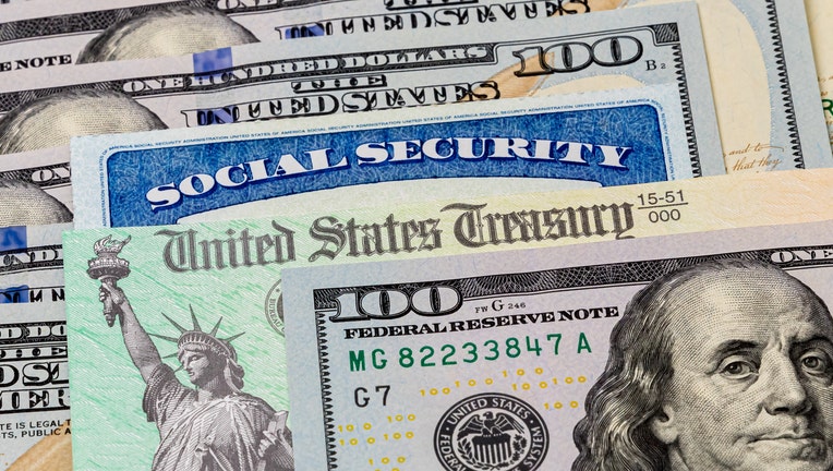 Social Security cards, treasury checks, hundred dollar bills.Concept of social security benefits payment, retirement and federal benefits