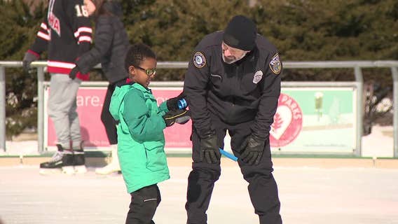 Kids, Milwaukee police ice skate at Red Arrow Park