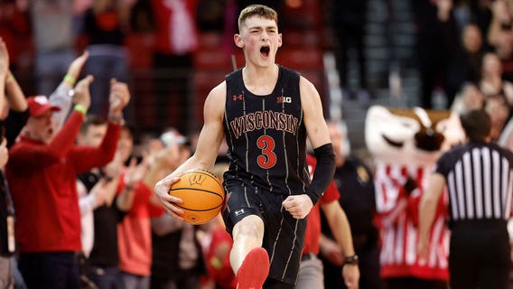 Wisconsin holds off Michigan 64-59