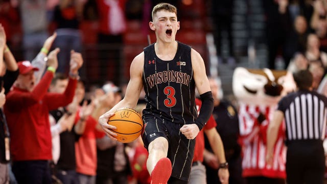 Wisconsin holds off Michigan 64-59