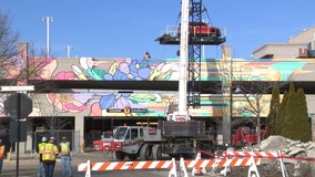 Bayshore parking garage collapse; crane removes remaining cars