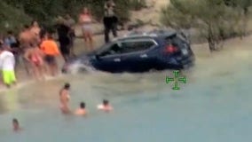 Watch: Florida woman arrested after driving onto beach, narrowly missing families