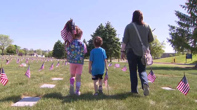 Flags placed, Memorial Day meaning passed to new generations