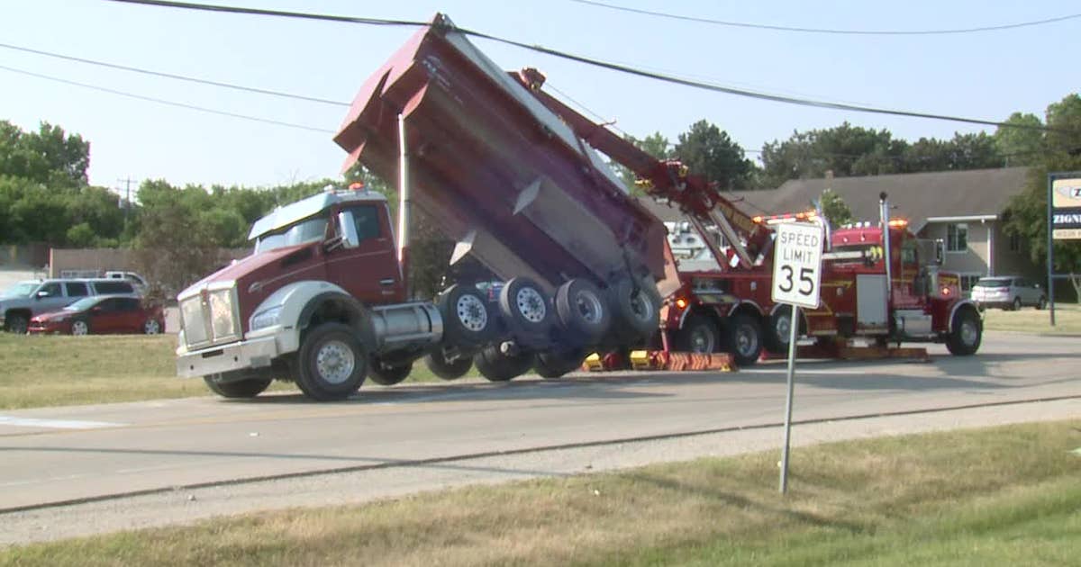 Pewaukee dump truck mishap; power lines snagged | FOX6 Milwaukee