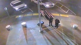 Florida police officers rescue American flag blown down during storms