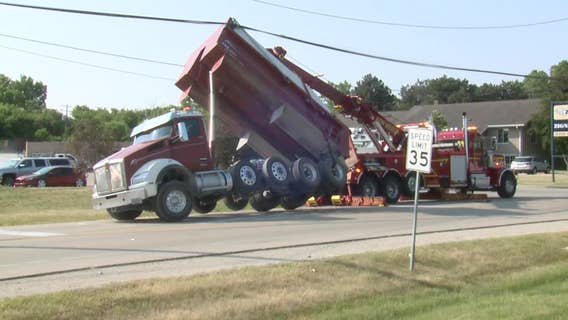 Pewaukee dump truck mishap; power lines snagged