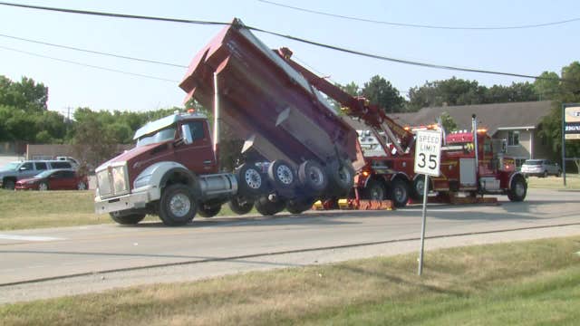 Pewaukee dump truck mishap; power lines snagged